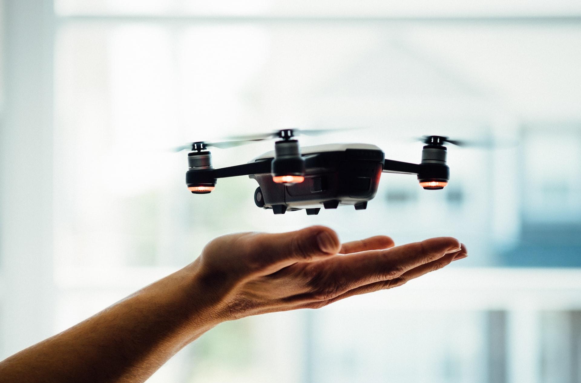 turned on black quadcopter drone